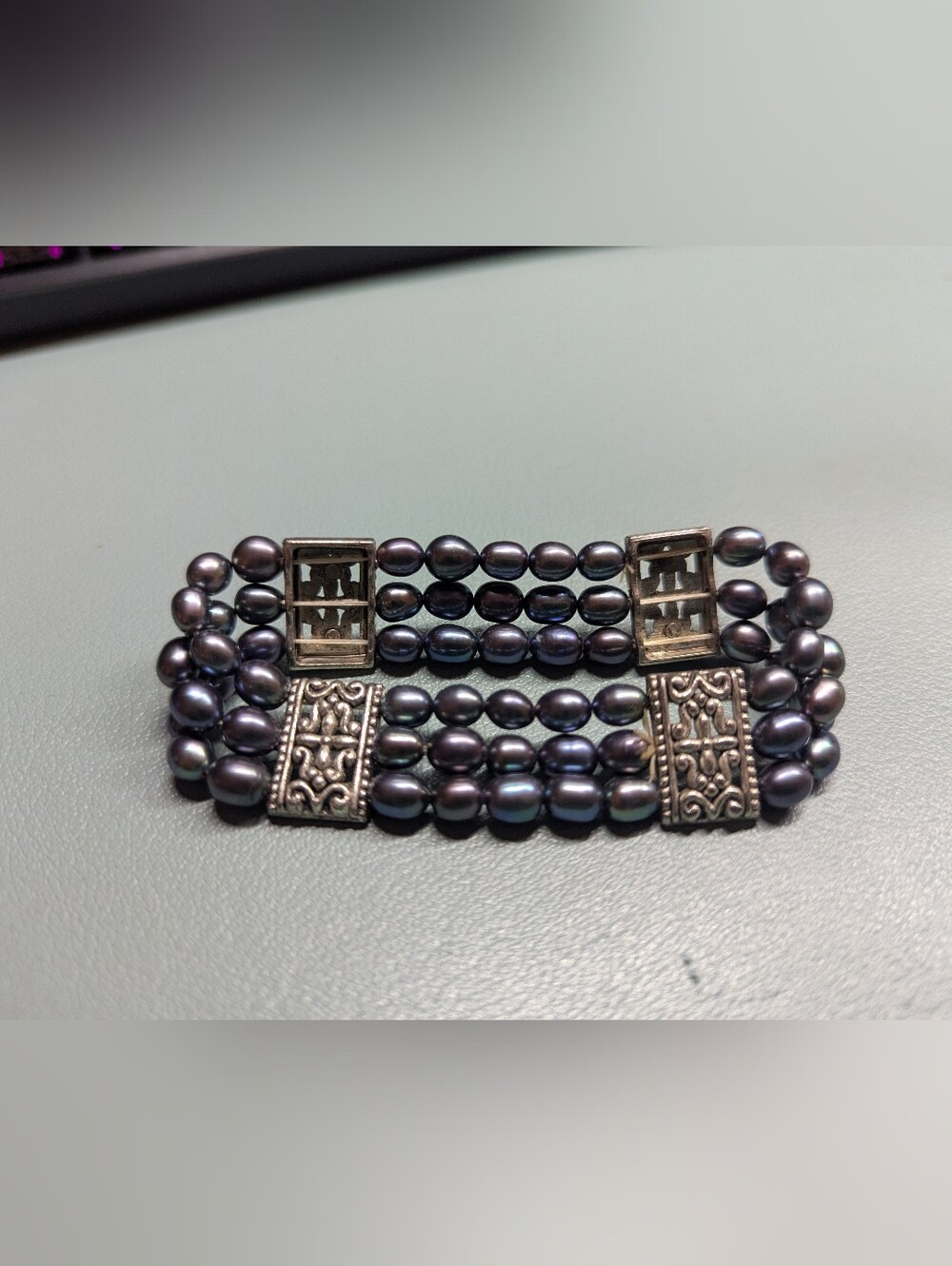 Multi-Strand Black Pearl Bracelet with Ornate Silver Accents